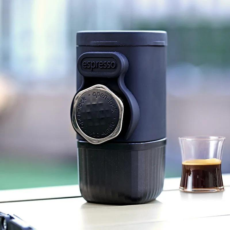 Bubblitz Nomad Press portable espresso maker beside a glass of espresso